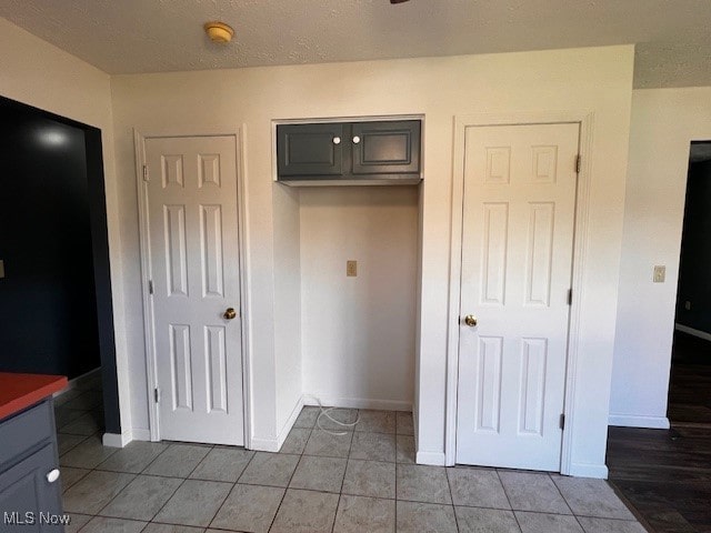 unfurnished bedroom featuring tile patterned floors