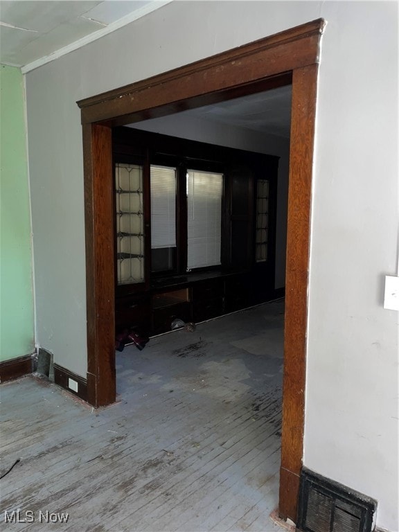 corridor with light hardwood / wood-style flooring