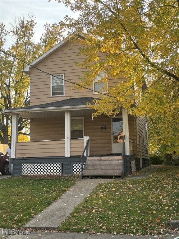 view of front of house featuring a front lawn and a porch