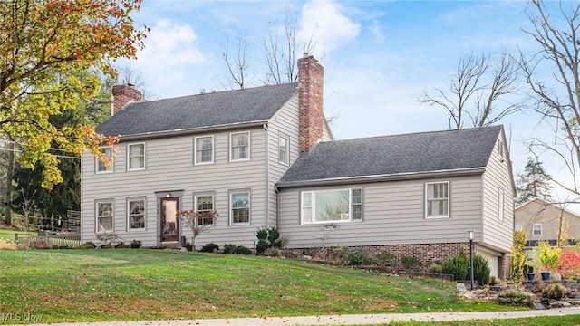 colonial-style house with a front lawn