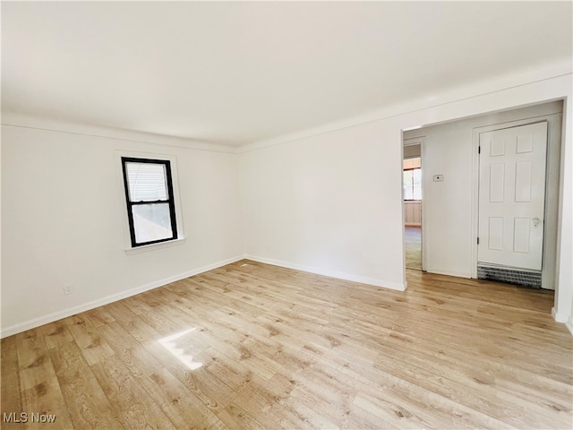 unfurnished room featuring light hardwood / wood-style flooring