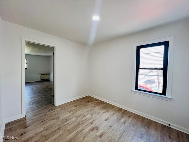 unfurnished room featuring light hardwood / wood-style flooring