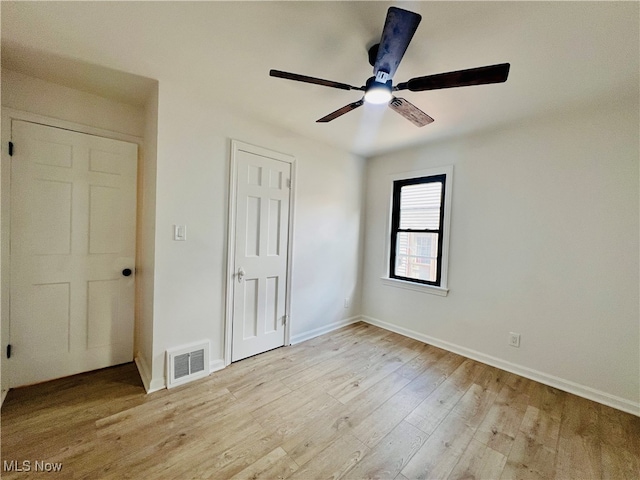 unfurnished bedroom with light hardwood / wood-style floors and ceiling fan