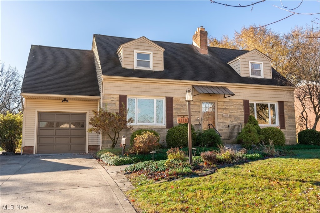 cape cod home with a front lawn