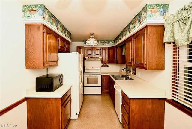 kitchen with white appliances and sink