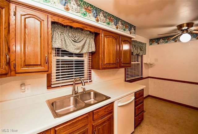 kitchen with white dishwasher, ceiling fan, and sink