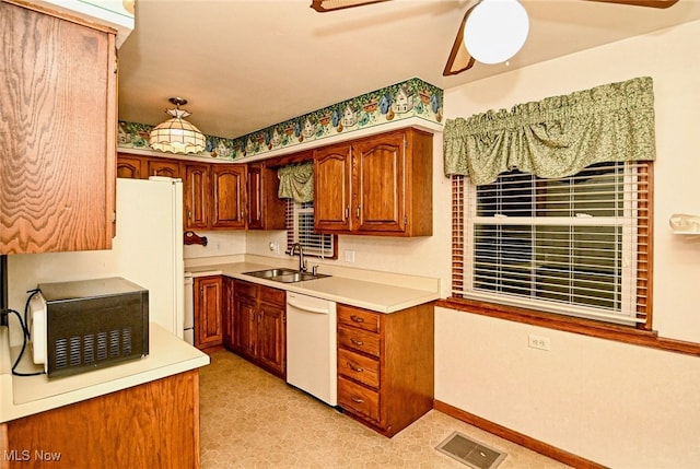 kitchen with ceiling fan, sink, and dishwasher