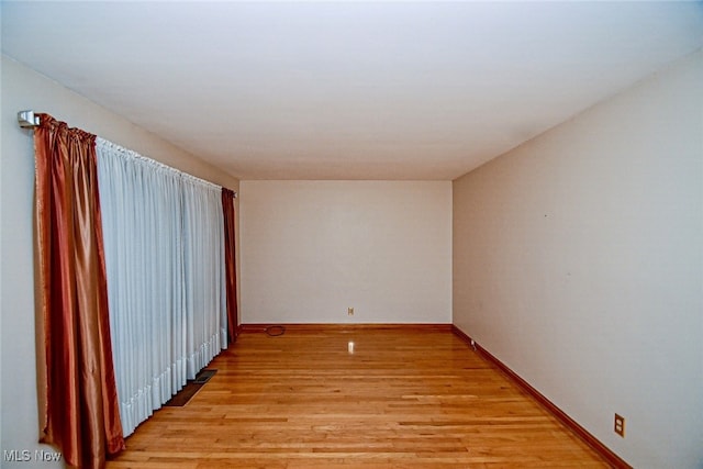 unfurnished room featuring light hardwood / wood-style flooring