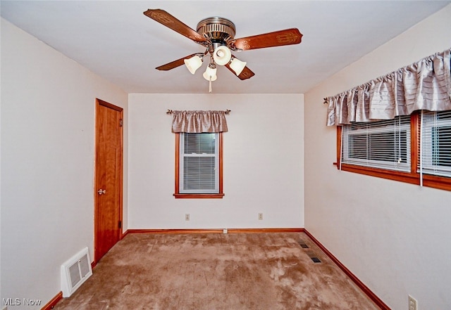 unfurnished room featuring carpet floors and ceiling fan