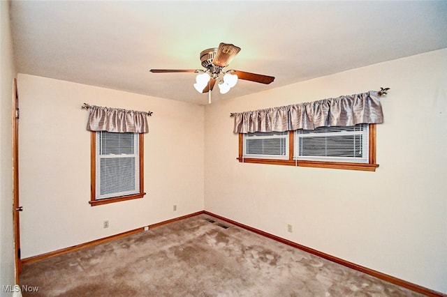 unfurnished room with carpet flooring and ceiling fan