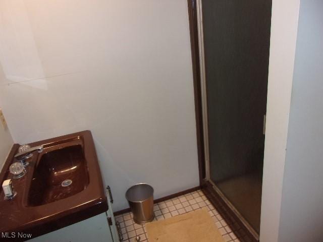 139 Melinda Dr, Wintersville, OH 43953 - bathroom with a shower with shower door and baseboards