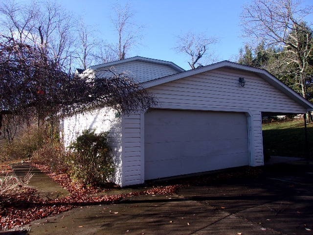 view of property exterior featuring a garage