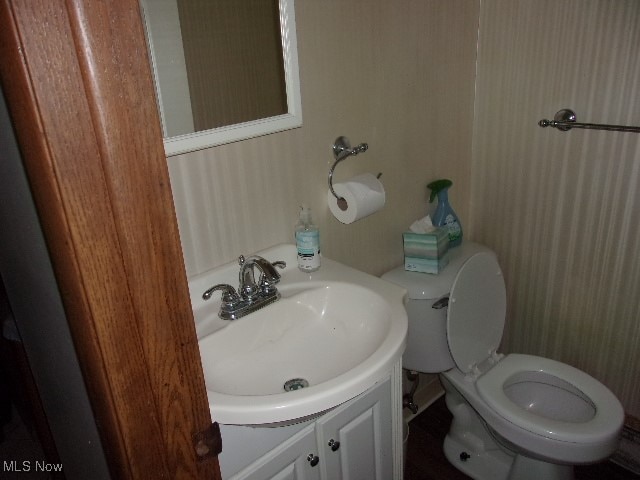 bathroom with vanity and toilet