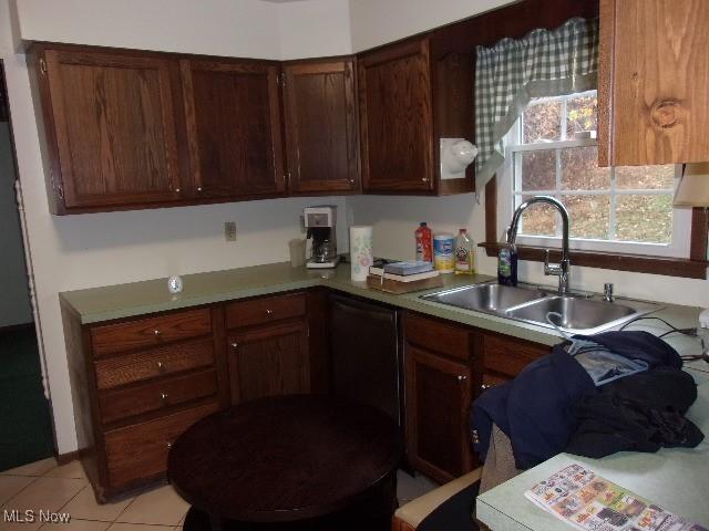 139 Melinda Dr, Wintersville, OH 43953 - kitchen featuring a sink, light countertops, light tile patterned flooring, and black dishwasher