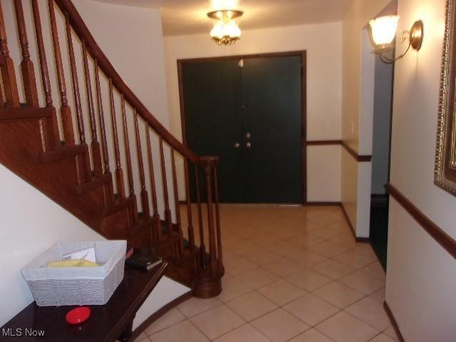 139 Melinda Dr, Wintersville, OH 43953 - entryway featuring stairway and light tile patterned floors