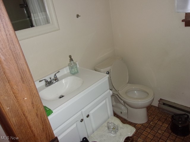 bathroom with toilet and vanity