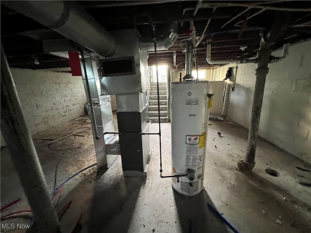 utility room with gas water heater