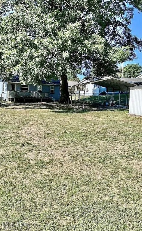 view of yard with a carport