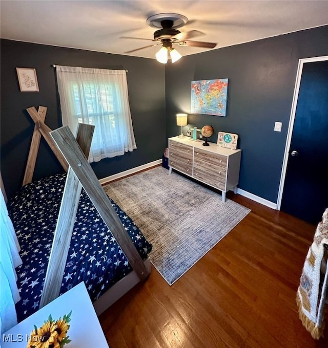 bedroom featuring dark wood-type flooring and ceiling fan