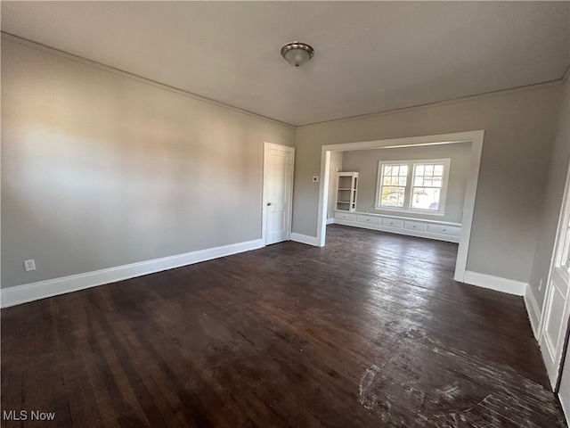 unfurnished room featuring dark hardwood / wood-style flooring