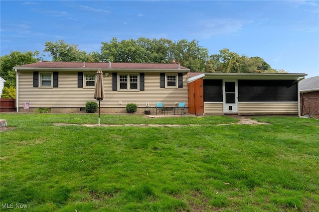 view of front facade featuring a front lawn and a patio area