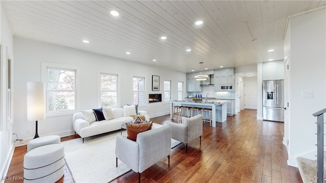 living room with hardwood / wood-style flooring and wooden ceiling