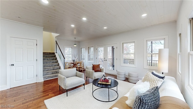 living room featuring french doors, hardwood / wood-style floors, plenty of natural light, and wooden ceiling