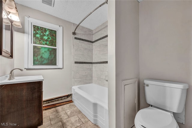 full bathroom with tiled shower / bath, a textured ceiling, vanity, a baseboard radiator, and toilet