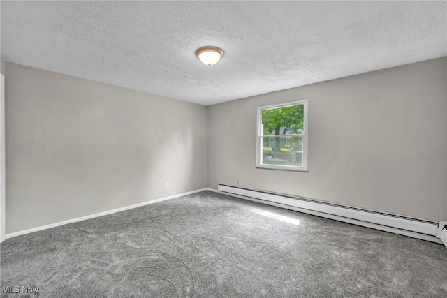 unfurnished room with baseboard heating, a textured ceiling, and carpet flooring