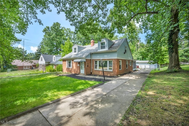 cape cod house with a front lawn