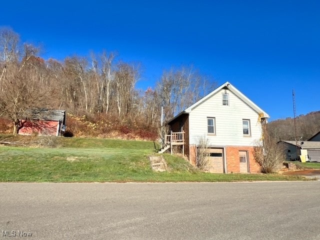 view of side of home featuring a garage