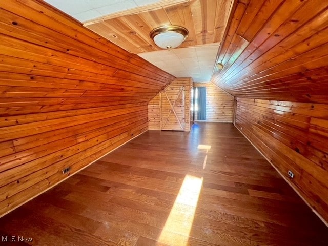 bonus room featuring wood ceiling, lofted ceiling, hardwood / wood-style flooring, and wooden walls