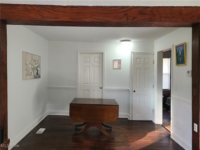 hallway with dark wood-type flooring