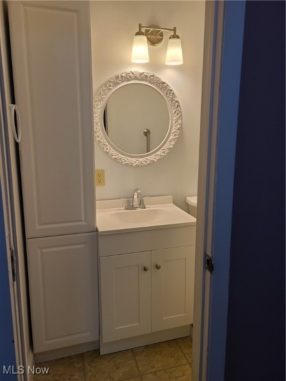 bathroom featuring tile patterned flooring and vanity