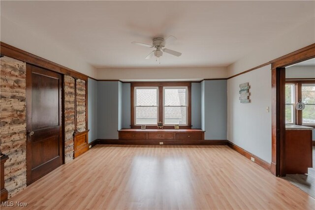 3594 W 49th St, Cleveland, OH 44102 - unfurnished living room with ceiling fan, light wood-type flooring, and baseboards
