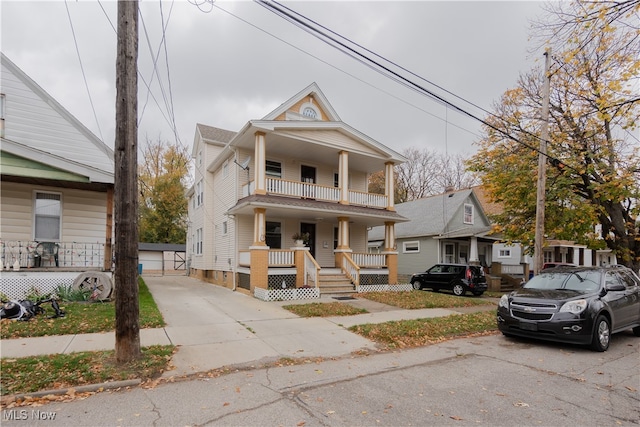 view of front of property with a garage and a porch