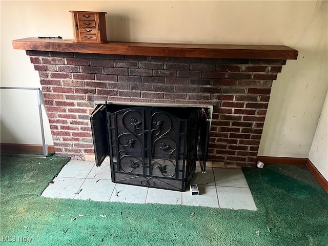 room details with a fireplace and carpet floors