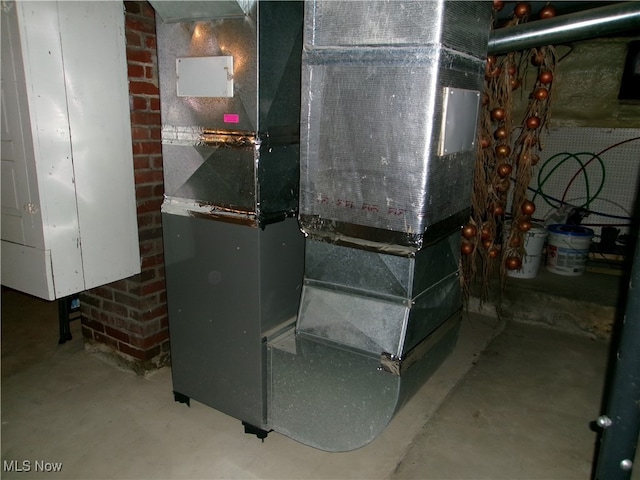 utility room with heating unit