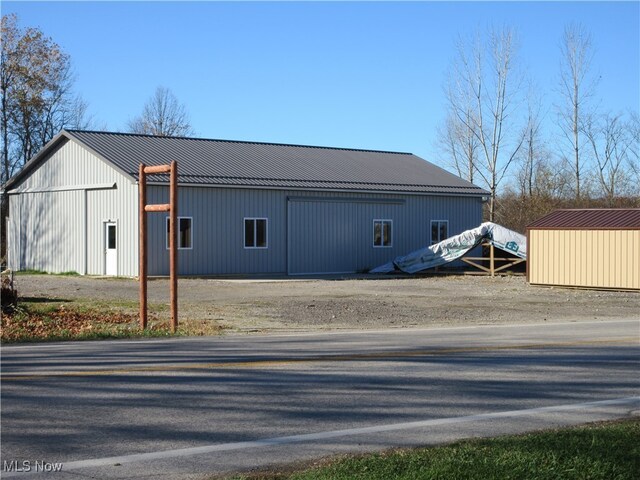 exterior space featuring an outbuilding