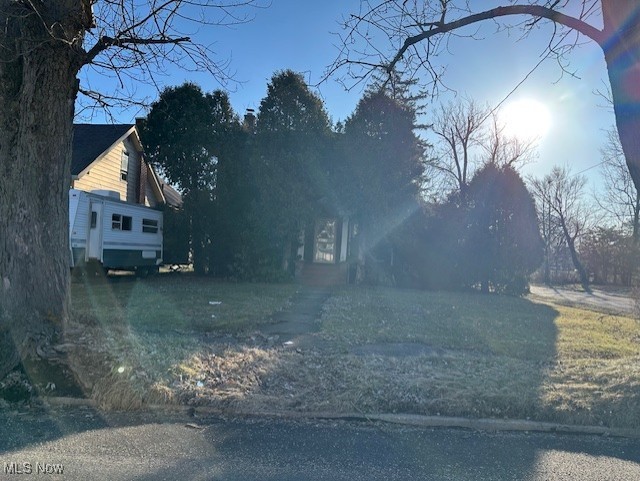 view of street featuring aphalt driveway