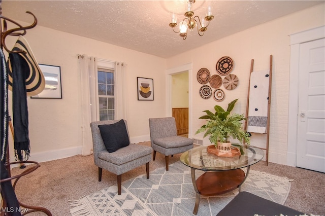 sitting room featuring carpet, an inviting chandelier, and a textured ceiling