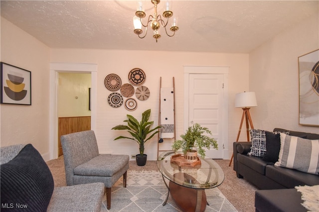 carpeted living room with an inviting chandelier and a textured ceiling