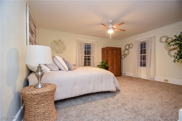 bedroom with ceiling fan and carpet floors