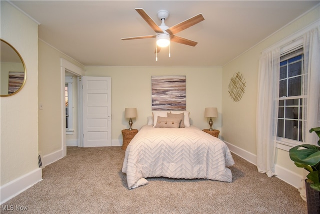 bedroom with light colored carpet and ceiling fan