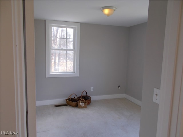 empty room with light colored carpet