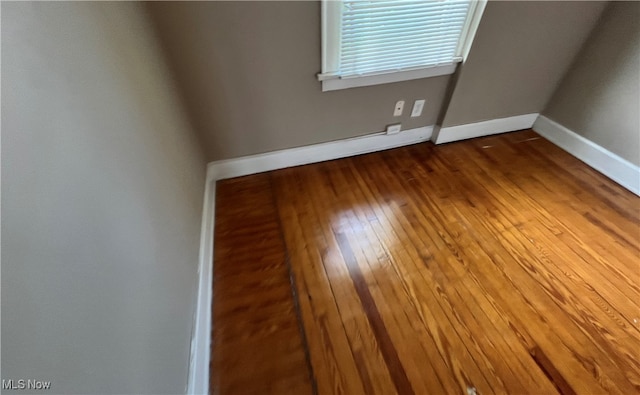 spare room featuring hardwood / wood-style floors