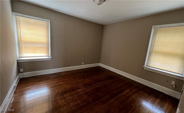 empty room featuring dark hardwood / wood-style floors