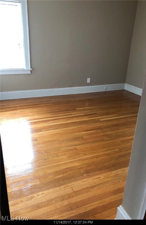 spare room with light wood-type flooring