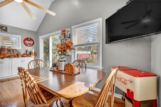 dining area featuring light wood-type flooring, vaulted ceiling, and ceiling fan