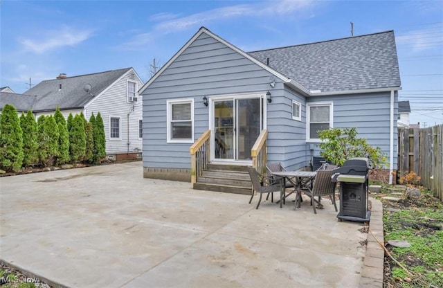 rear view of property featuring a patio area